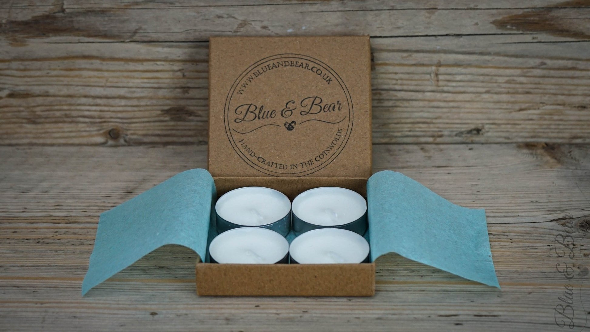 A set of four natural wax tea lights from Blue & Bear in a kraft paper presentation box stamped with the Blue & Bear logo.  Perfect for use with our essential oil products.