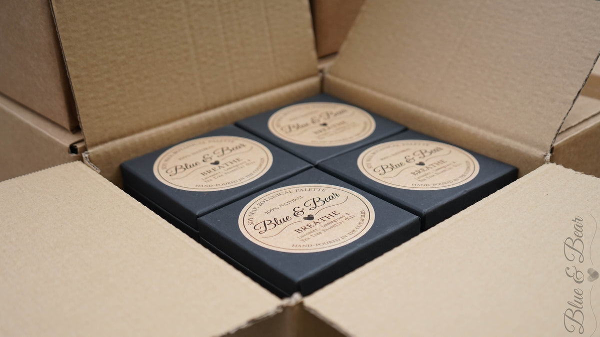 An open case of Blue & Bear Botanical Palettes with other cases ready for a bulk order Wholesale delivery.  Attractive margins for resellers.